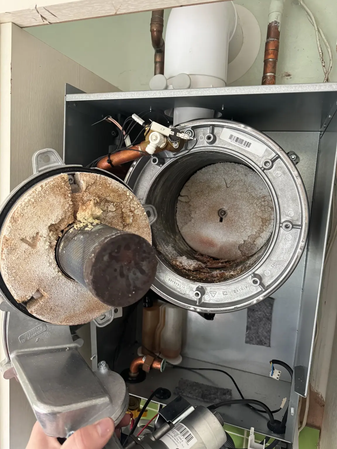 Boiler burner before servicing with damaged insulation pads